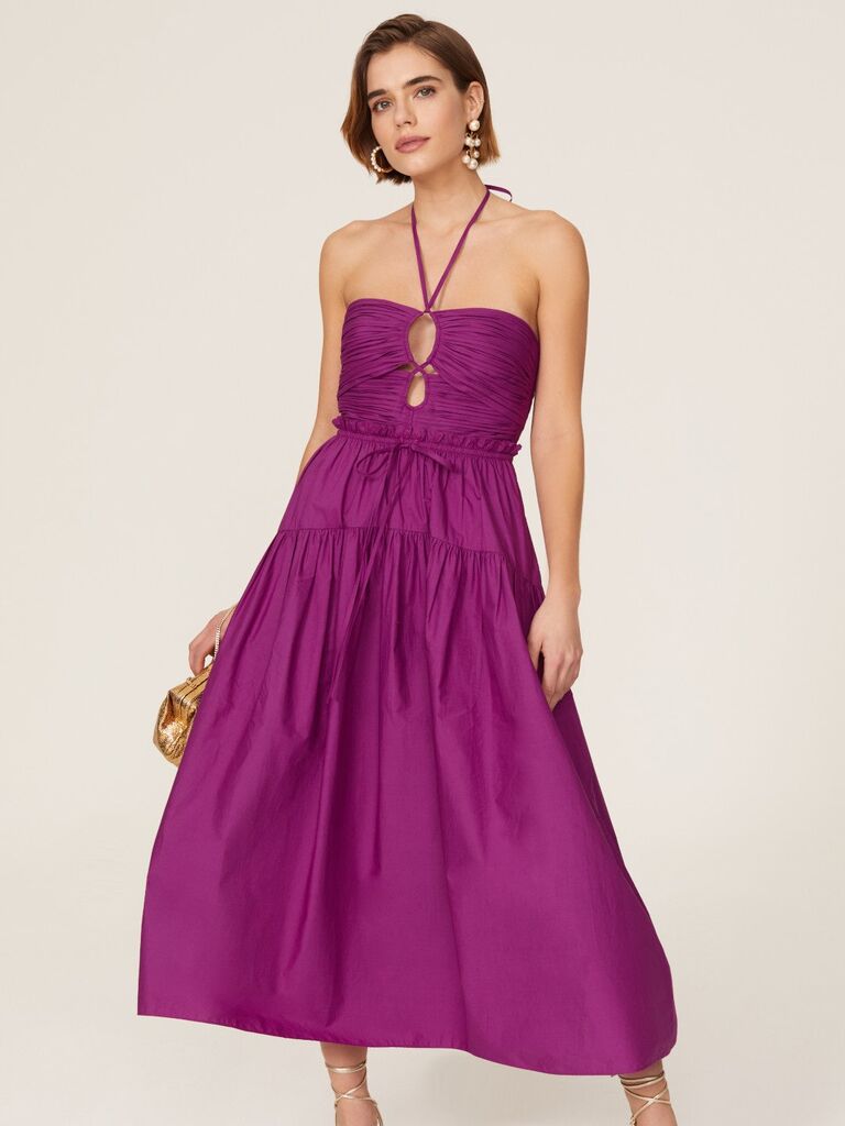 Purple mid-length dress for a beach wedding. 