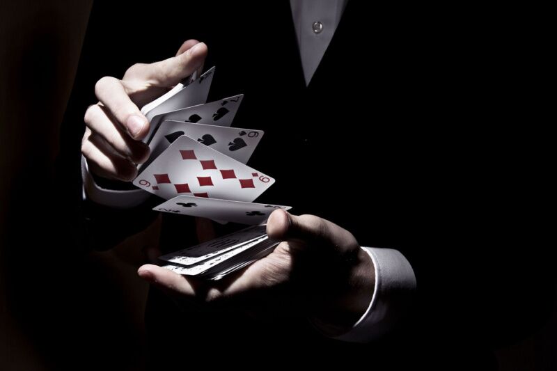 magician hands with playing cards