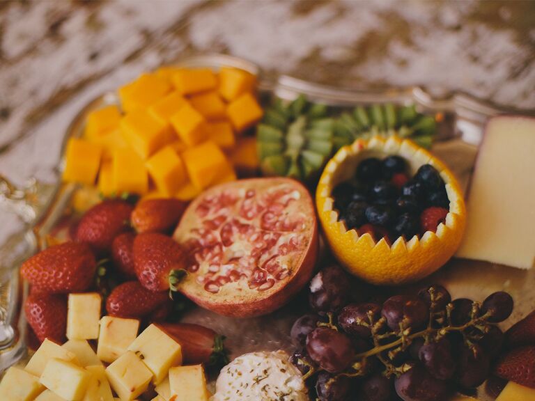 Fruit and cheese grazing table at wedding