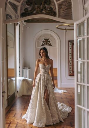 Solaris — all embroidered with sparkling beads, featuring heart-shaped neckline corset top with cutout sides and gown like voluminous split skirt also beaded all over.