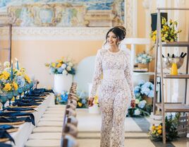 Woman walking in a bridal shower event space surrounded with blue and yellow florals