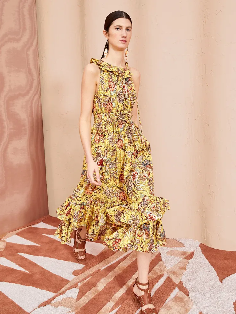 A ruffled, tiered yellow floral midi dress from Ulla Johnson