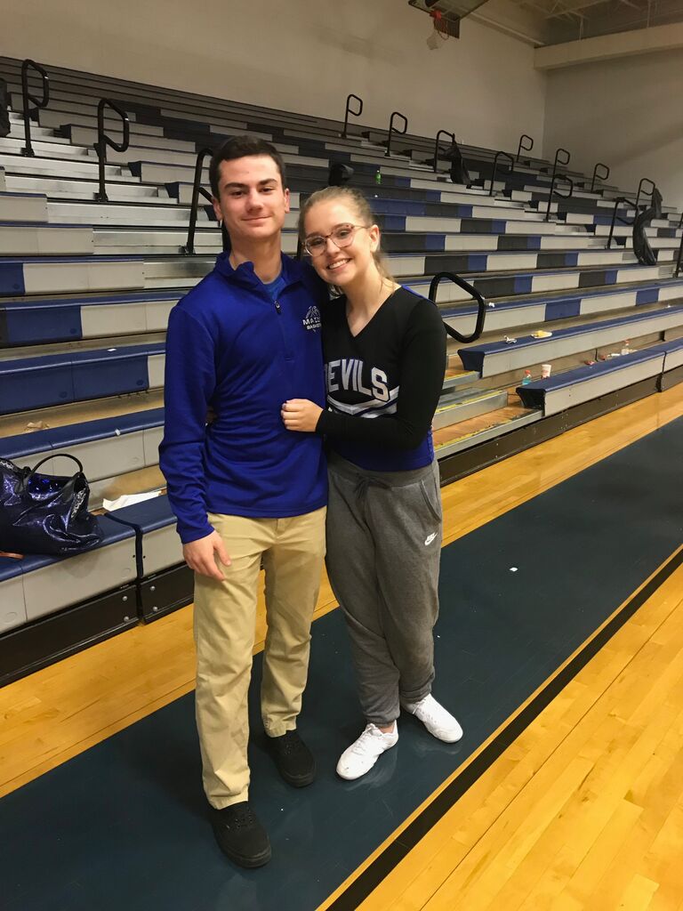 A basketball player and his cheerleader