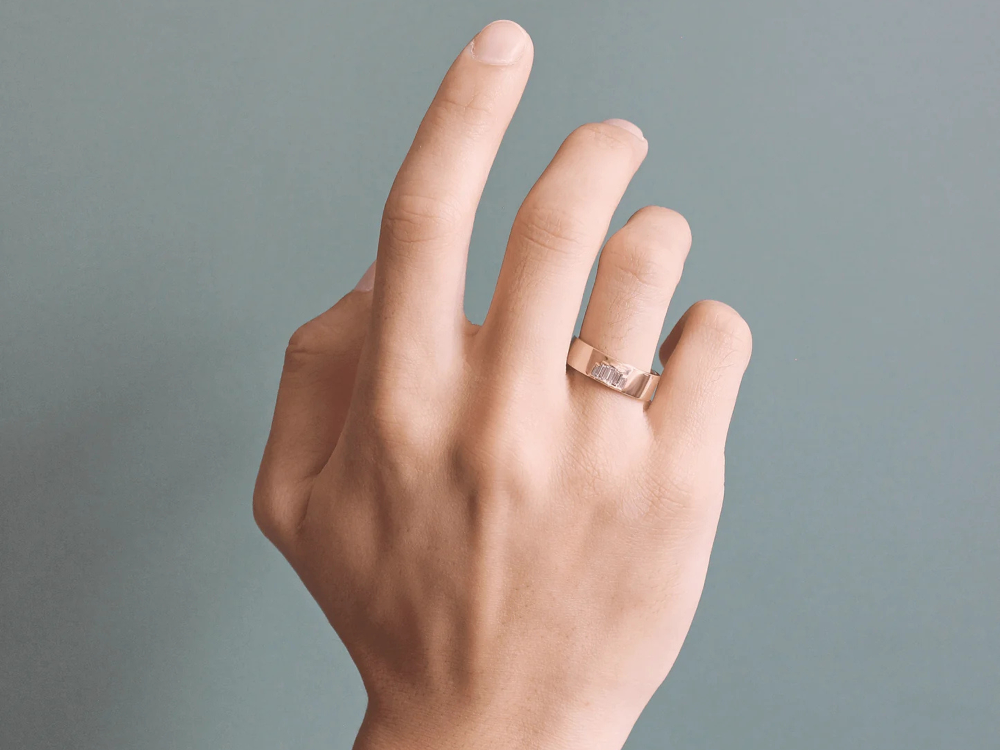 Gold baguette diamonds gender neutral engagement ring from Goldpoint