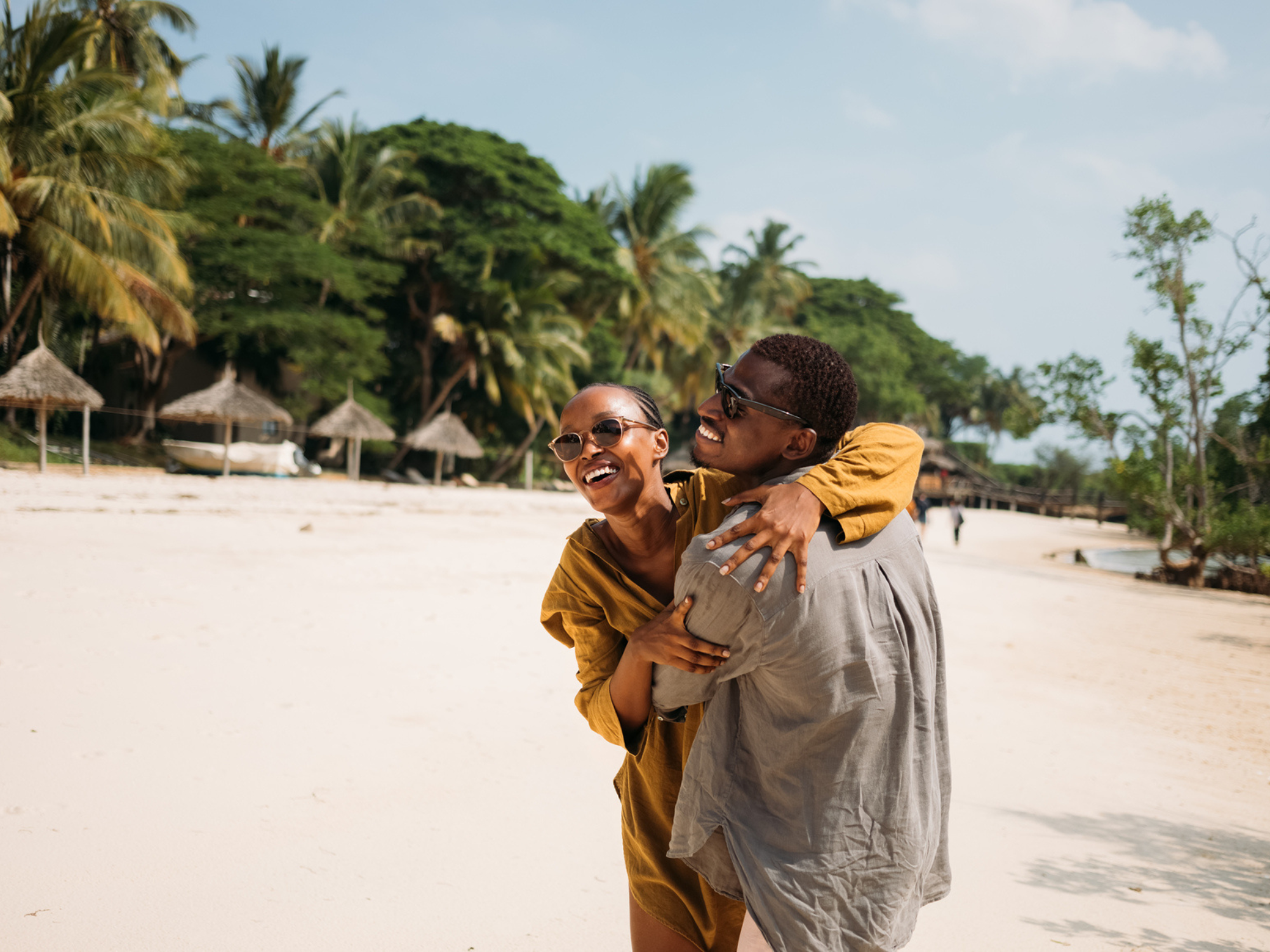 Couple on beach in Tanzania, July honeymoon destinations