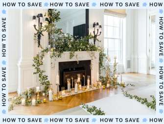fireplace decorated with greenery and candles