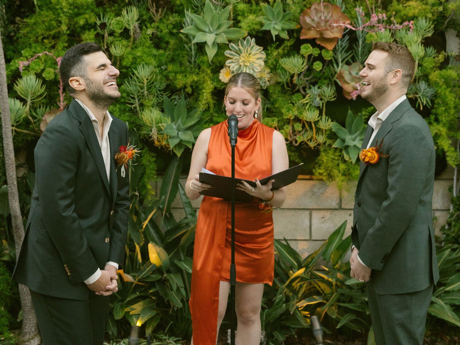 Officiant with couple at wedding