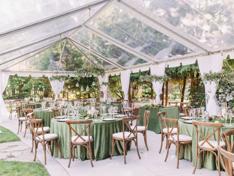 Clear tent over outdoor wedding reception 