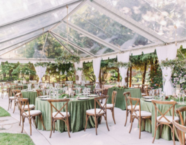 Clear tent over outdoor wedding reception 