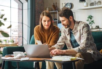 Couple on a laptop doing their finances