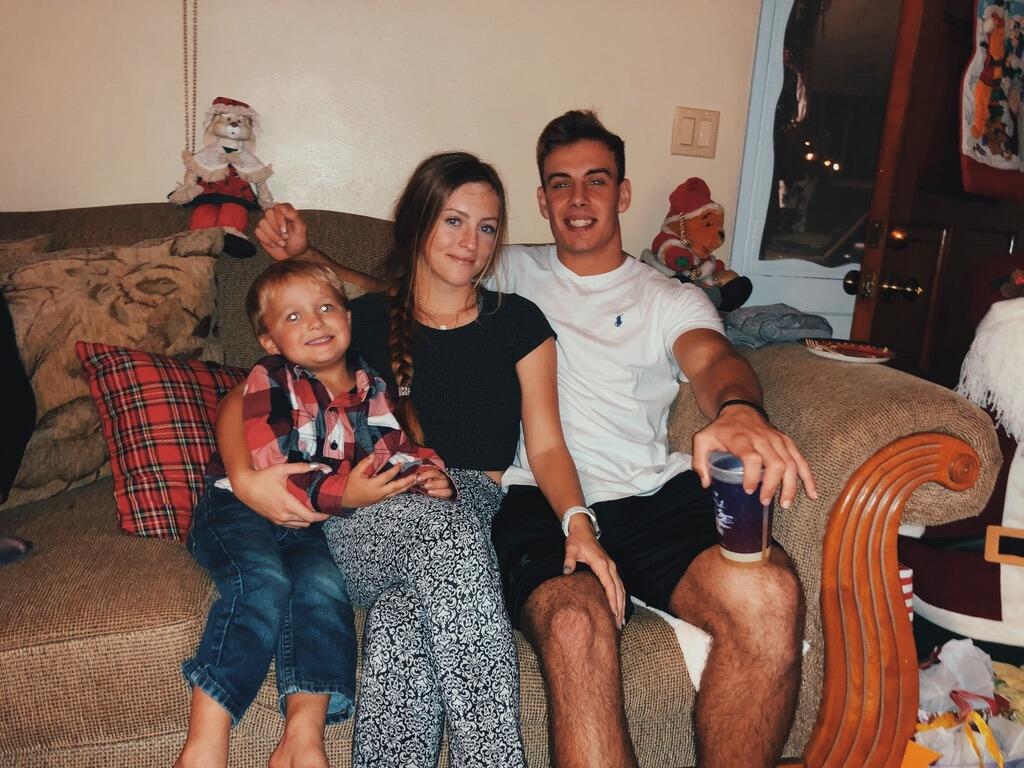 Merrik, Emma, and Brett celebrating Christmas at Oma's!