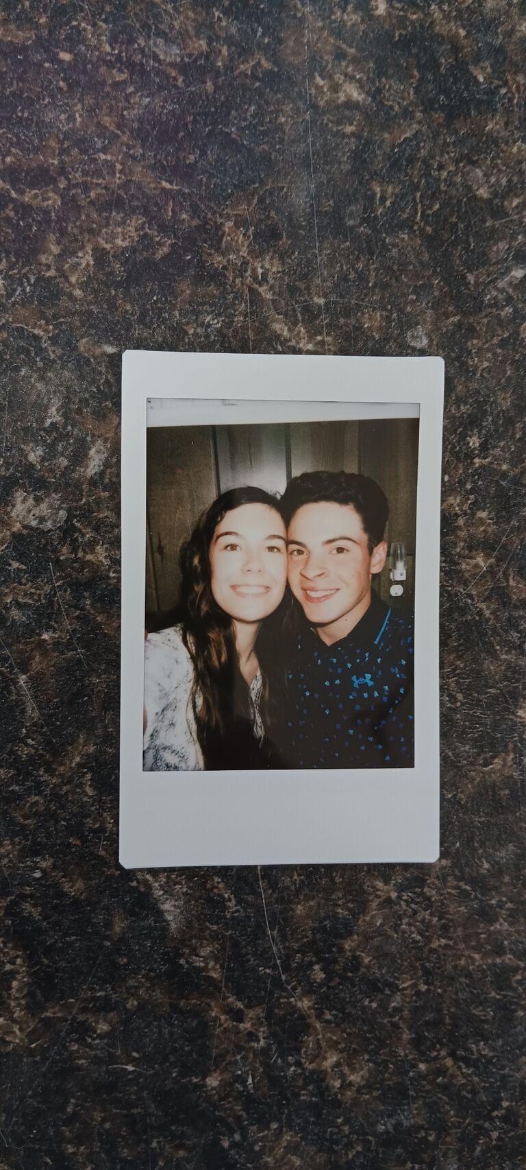 A polaroid taken at a graduation party.