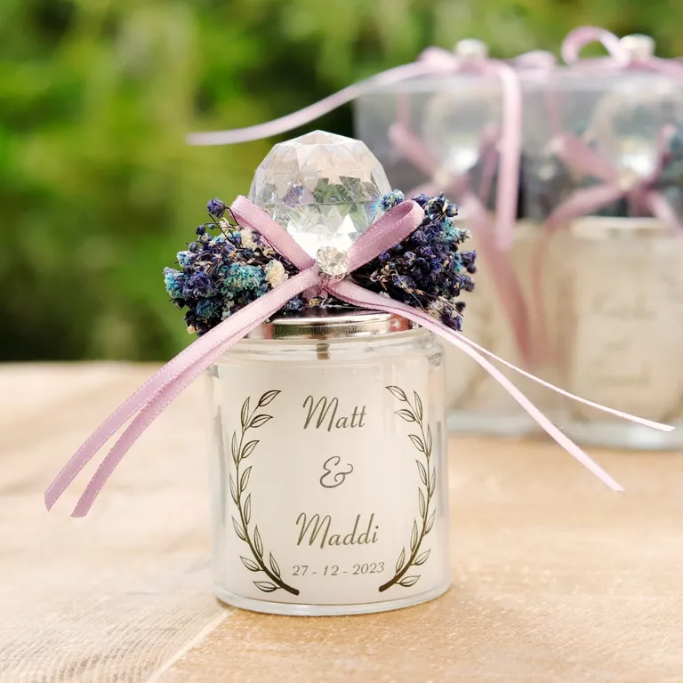 Elegant personalized candle wedding favor with dried purple flowers