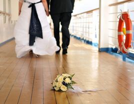 Bride and groom walking the deck of a ship