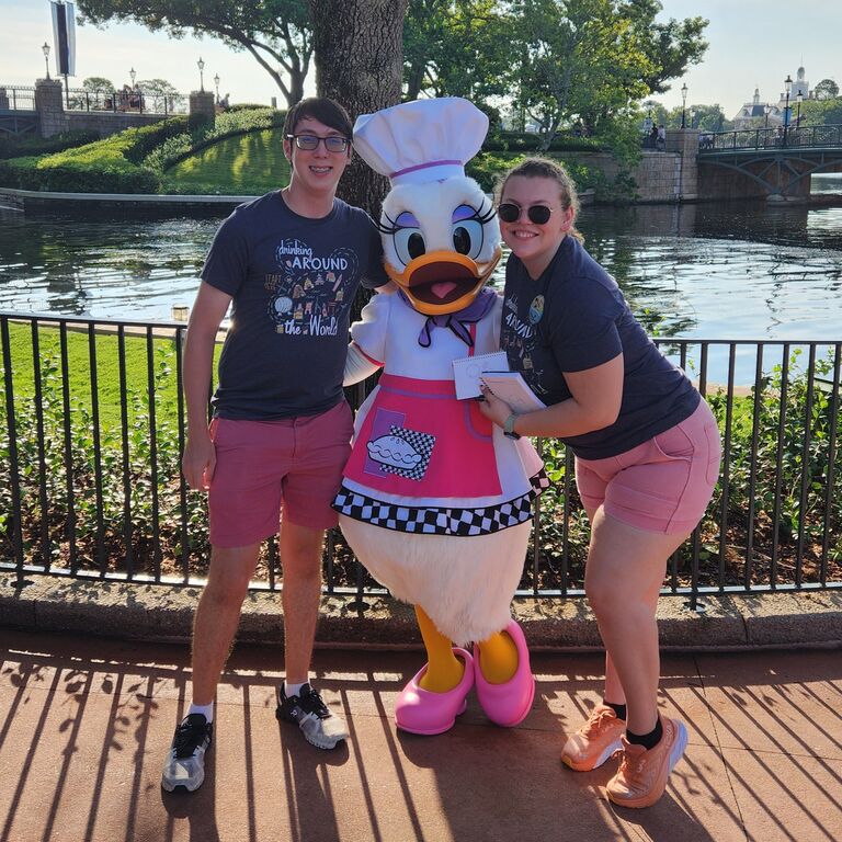 Aiden and Meredith's first disney trip was almost exactly one year before getting engaged. If you look in the top right corner you can see the France Pavillion where they got engaged.