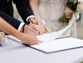 Couple signing marriage license