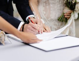 Couple signing marriage license