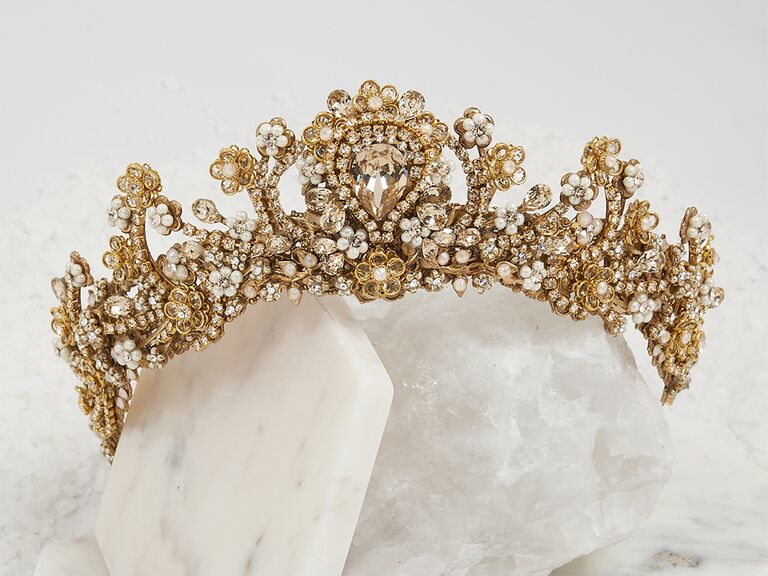 Gold floral style crown with pearl details and teardrop crystal in center