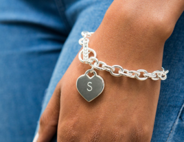 Silver chain bracelet with initial on heart charm