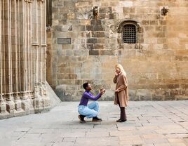 Woman proposing to her fiancée outside