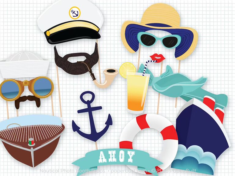 Sailor photo props like anchor, sailor hat, beach hat, sign saying Ahoy