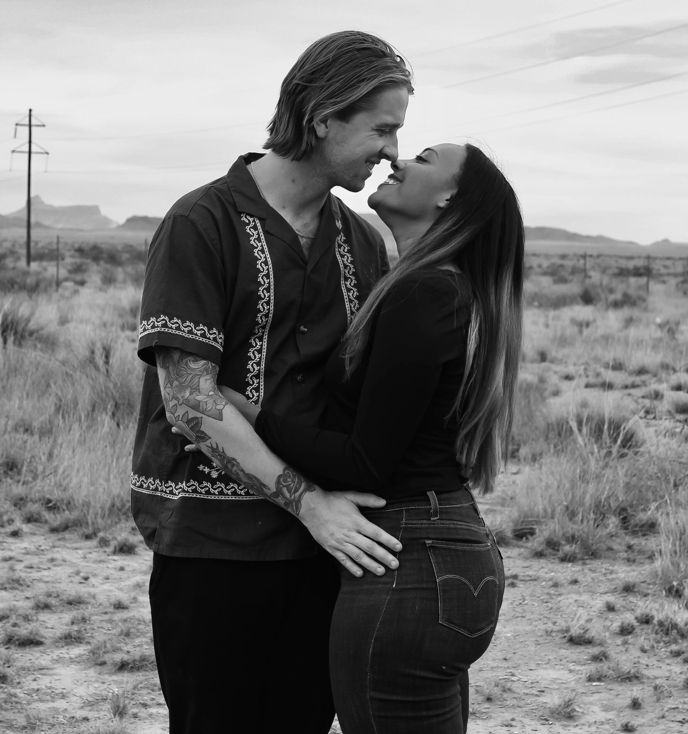 The happy couple poses in Marfa, Texas.