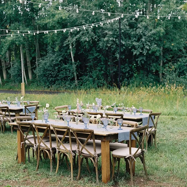 Wood tables with blue runners, taylor swift themed wedding