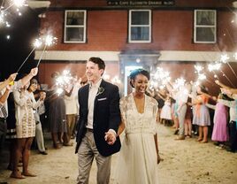 Bride and groom exiting wedding reception