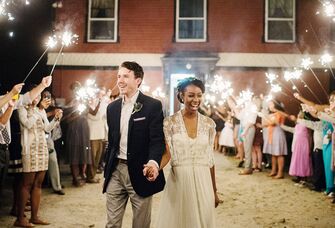 Bride and groom exiting wedding reception