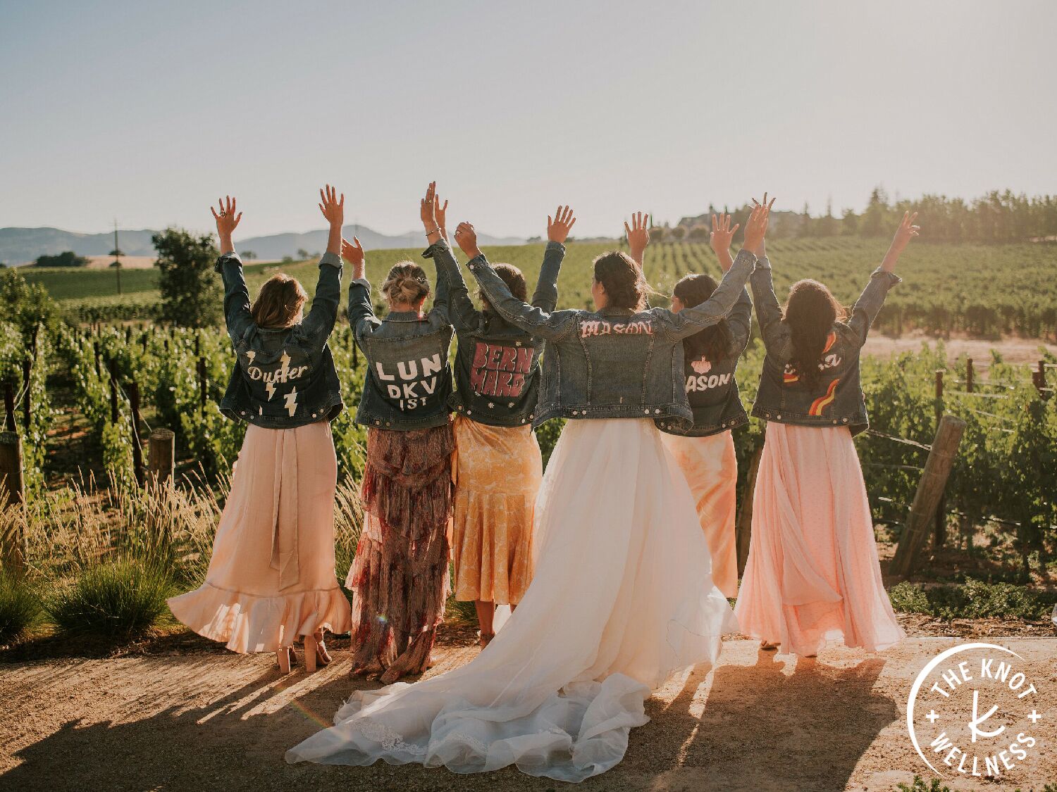 bride and bridesmaids wearing custom denim jackets