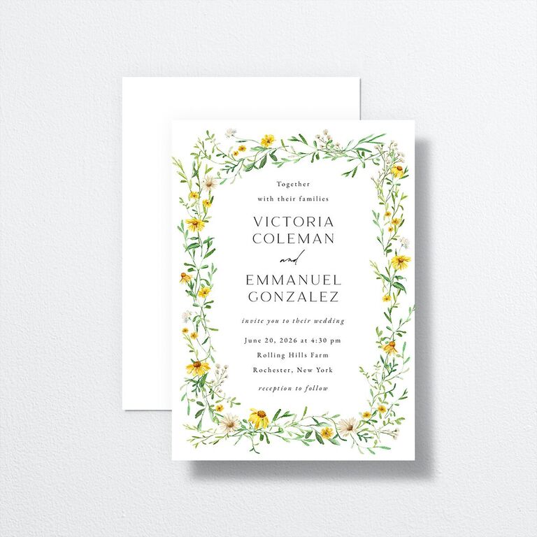 White wedding invitation with wildflower border
