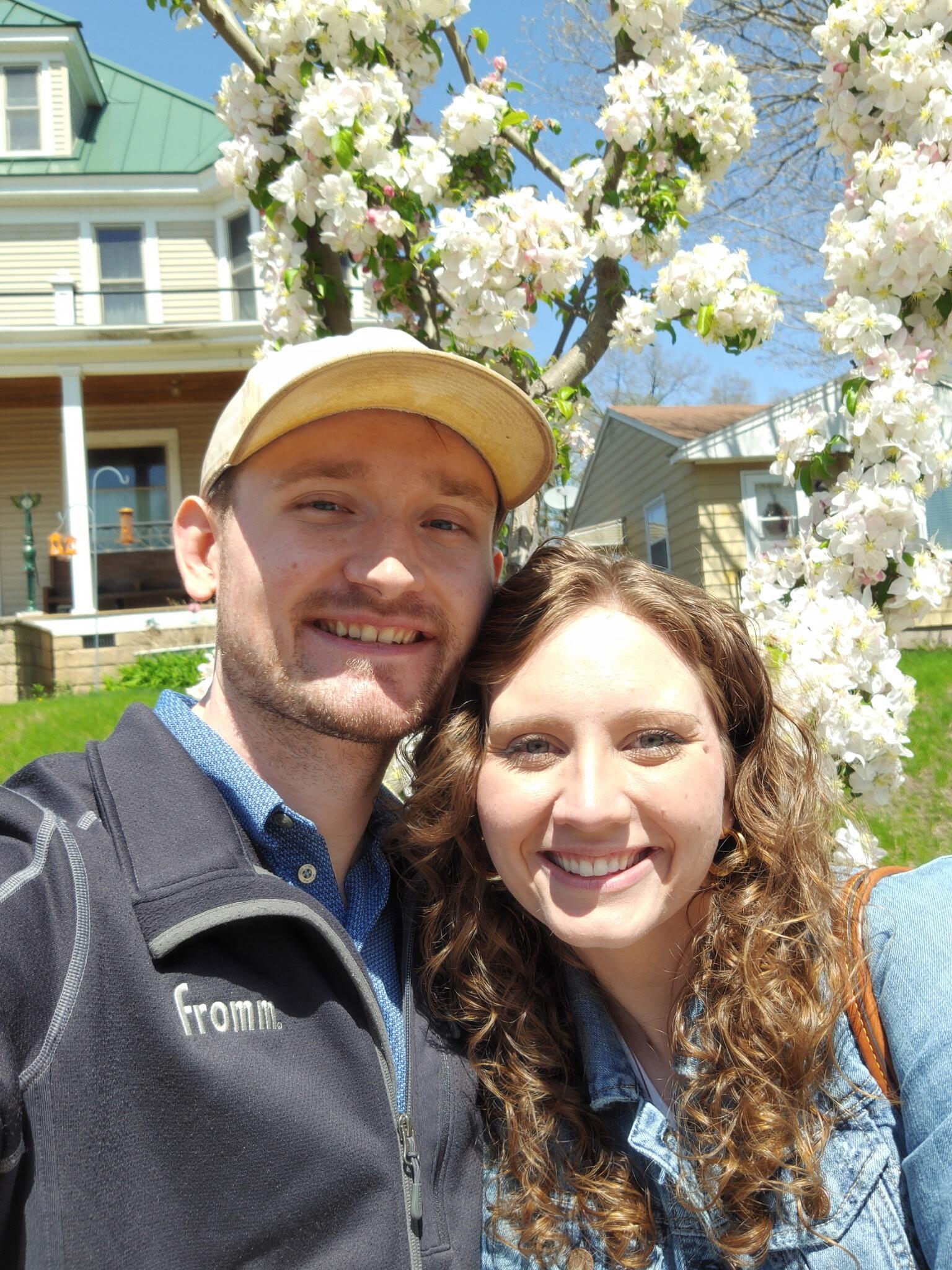 Adorable picture in front of this tree by church.