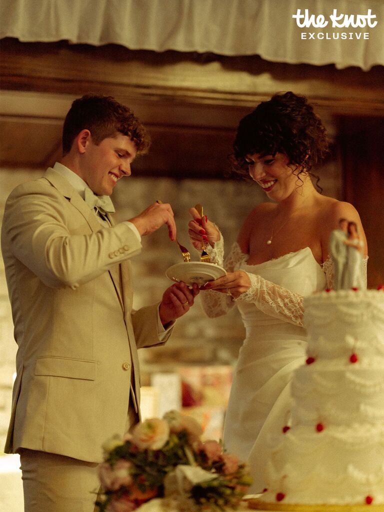 Tommy Winkler and his wife tasting their wedding cake