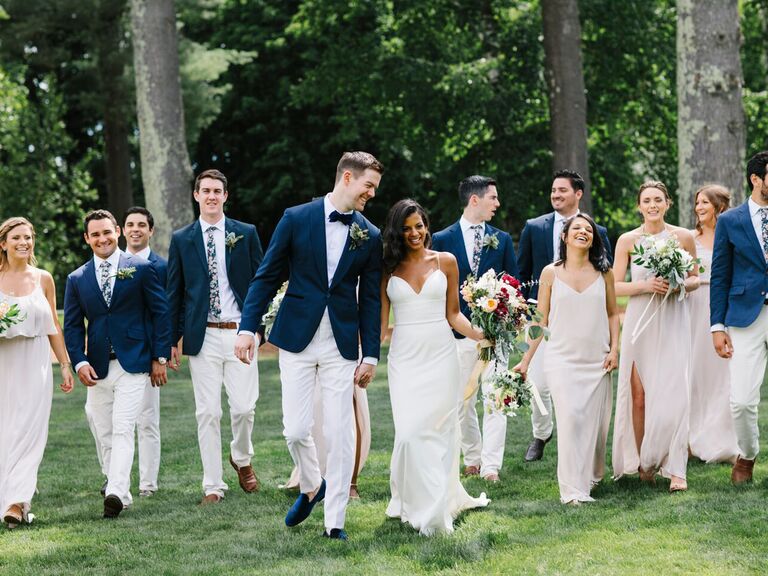 couple and wedding party walking together