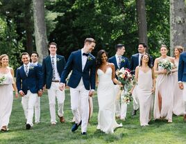 couple and wedding party walking together