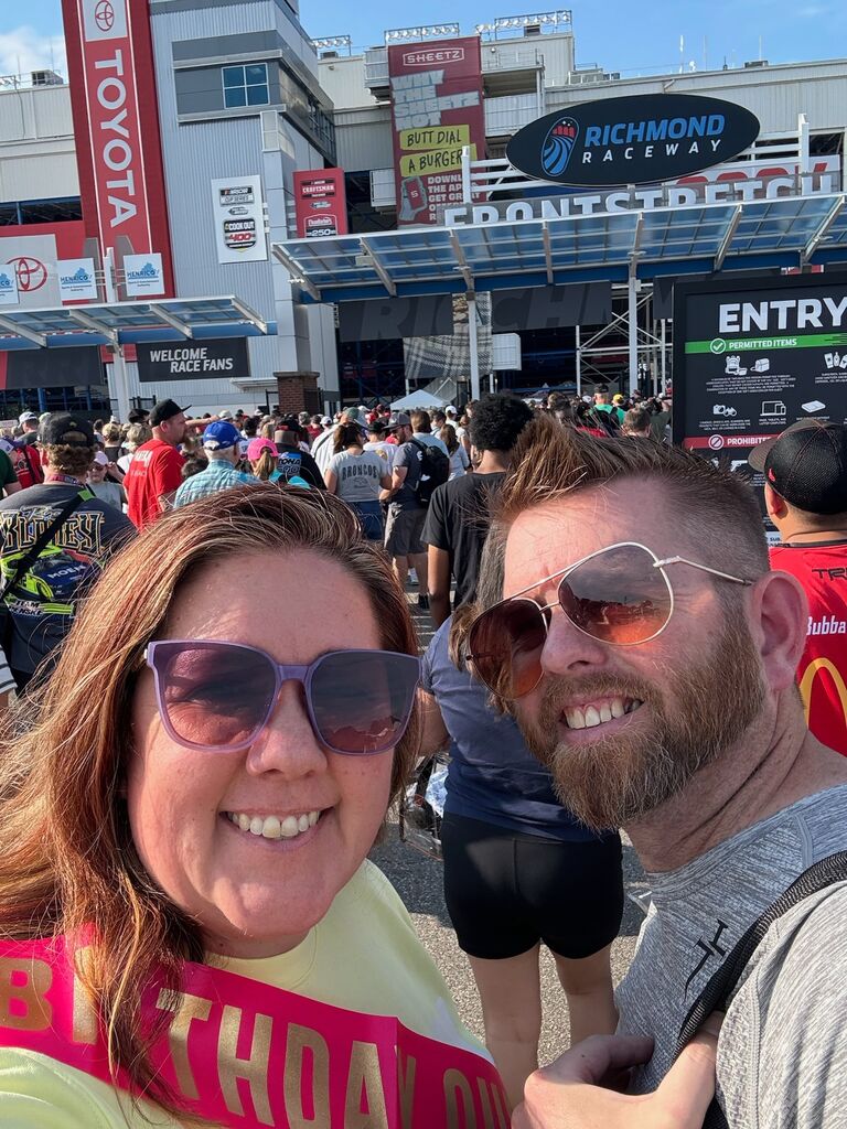 Trish surprised Mike with tickets to the NASCAR Richmond race for his birthday. 