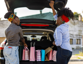 Women packing up car for wedding