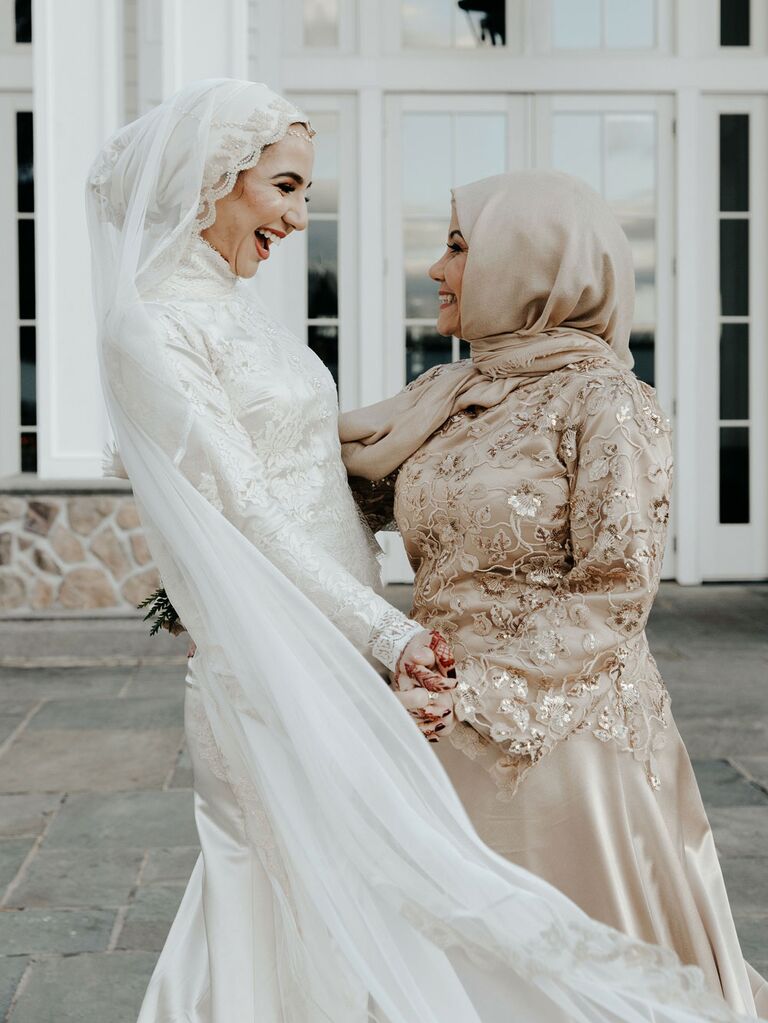Bride with maid of honor on wedding day