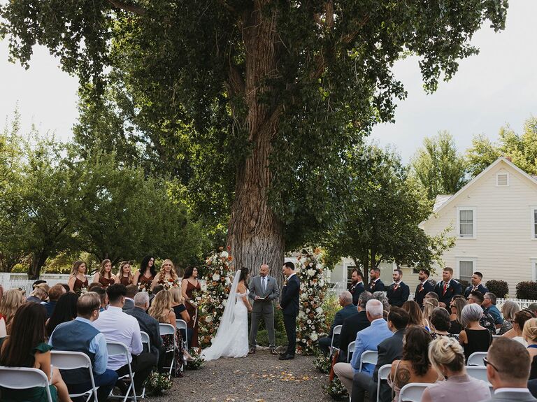 Wedding ceremony underneath a grand oak tree at Jacobs Berry Farm
