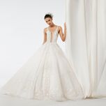 model wearing beaded ball gown with baby's breath flower crown in updo