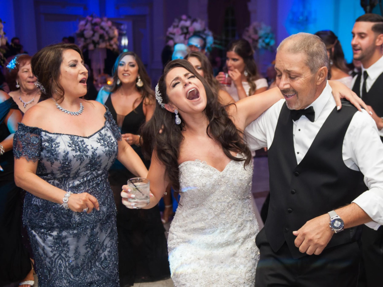Bride singing with family members at reception with music by Critical Entertainment wedding DJ in Connecticut