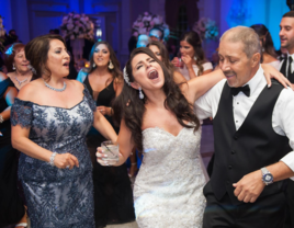 Bride singing with family members at reception with music by Critical Entertainment wedding DJ in Connecticut