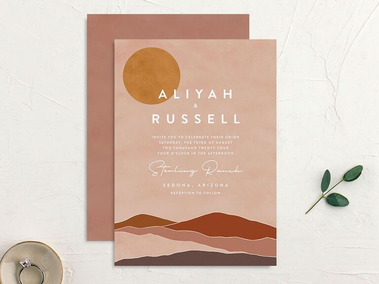 Muted pink and red desert-themed destination wedding invitation