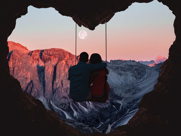 couple on swing in heart cave switzerland honeymoon advisor planner