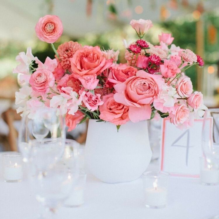 pink flower arrangement in white vase