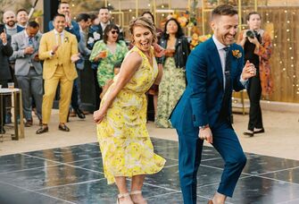 Mother and son dancing at wedding 