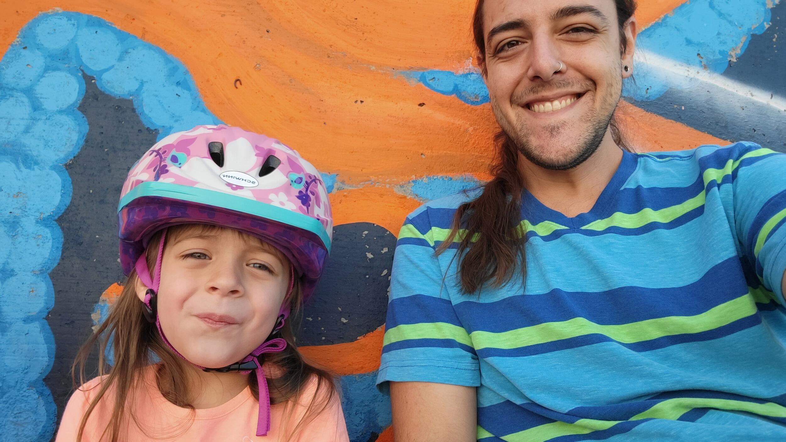 Alex teaches Ada to ride her bike. First sick day with a kiddo