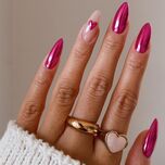 Pink chrome Valentine's Day nails with a heart design