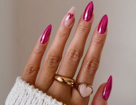 Pink chrome Valentine's Day nails with a heart design