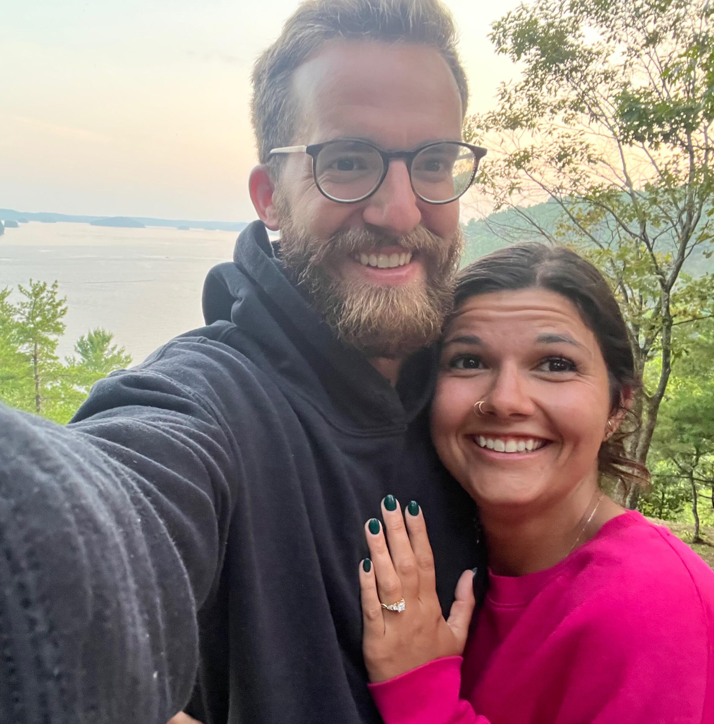 Our 9 month anniversary and engagement, while at MBC. 

How it went down:
James forced Brooke to go on a nearly two hour trail walk. Followed by a small canoe ride to Blueberry Mountain. After scaling the mountain on foot, we had a small dinner, while the sun set. 

With James's heart beating out of his chest, Brooke read a romantic letter that ended with James carefully (as to not drop the ring down the mountain) getting down on one knee and asking The Big Question! 

Brooke said YES!! And now you are being invited to a wedding.